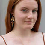 Boucles d'oreilles longues feuilles lisses, en acier inoxydable doré - Boutique We Are ParisLes Cléias Acier Inoxydable