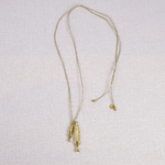Chaîne en lurex gri - gri pendentif poissons en acier inoxydable doré - Boutique We Are ParisLes Cléias Acier Inoxydable