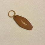 Porte - clé BISOUS – Cuir recyclé & acier doré - Boutique We Are ParisLes Cléias Acier Inoxydable