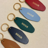 Porte - clé BISOUS – Cuir recyclé & acier doré - Boutique We Are ParisLes Cléias Acier Inoxydable